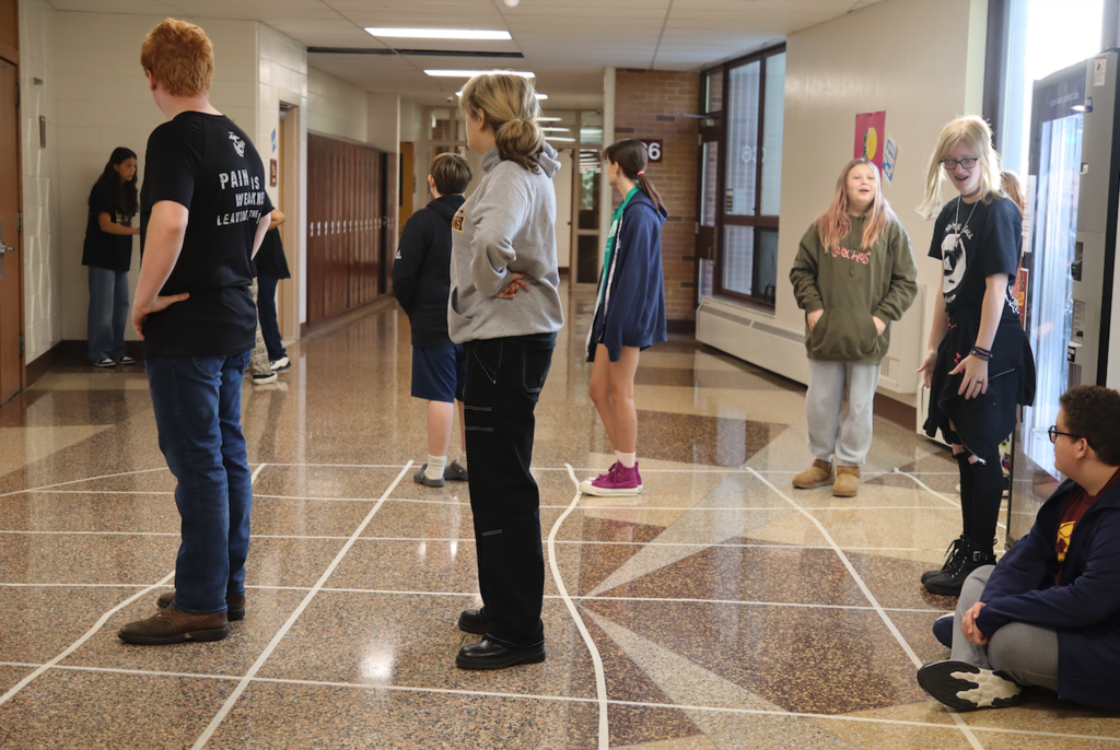 group of students standing in hallway