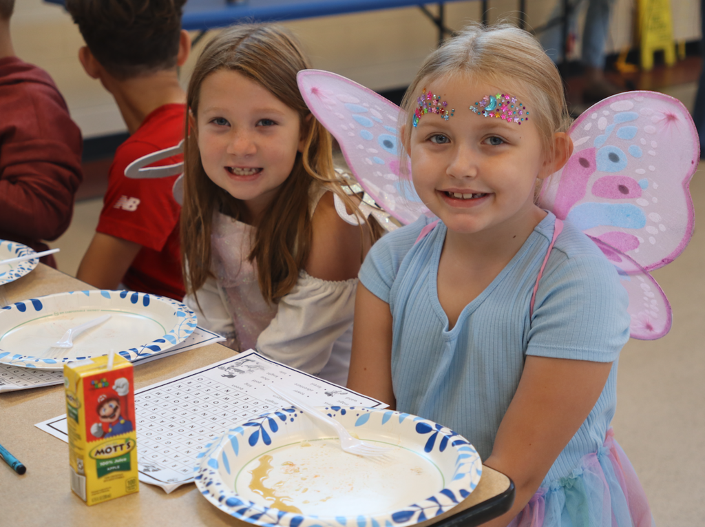 two little girls in fair dresses