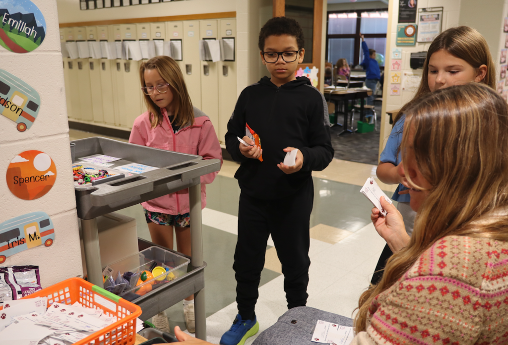 students standing in front of a cart