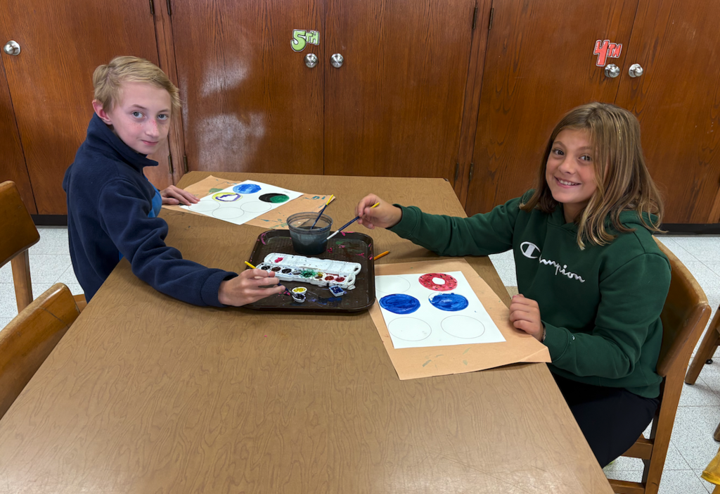 students making dots in art class