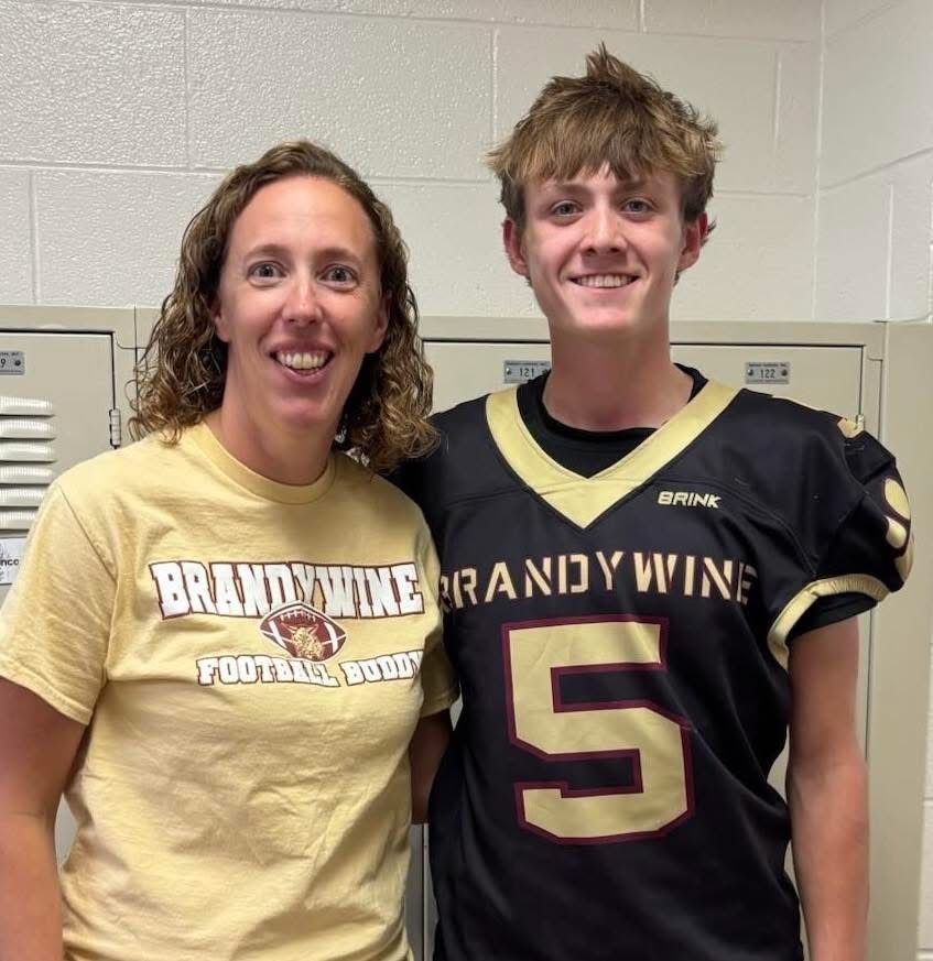 teacher with football player