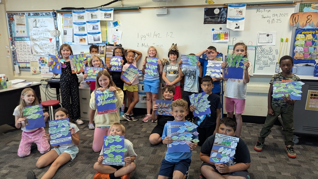 students holding up their constitution day projects for branches of government
