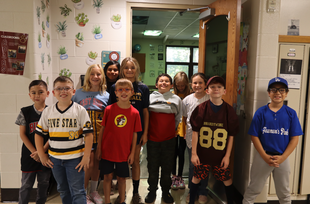 class in their team shirts