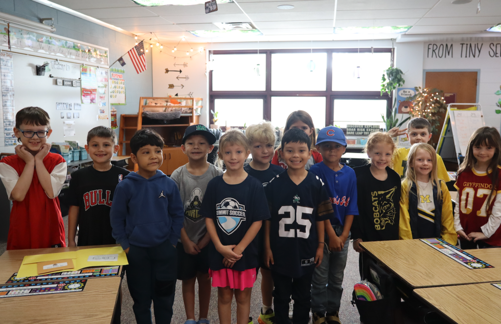 class in their team shirts