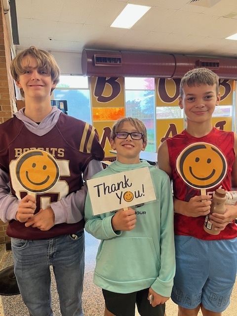 students with thank you sign