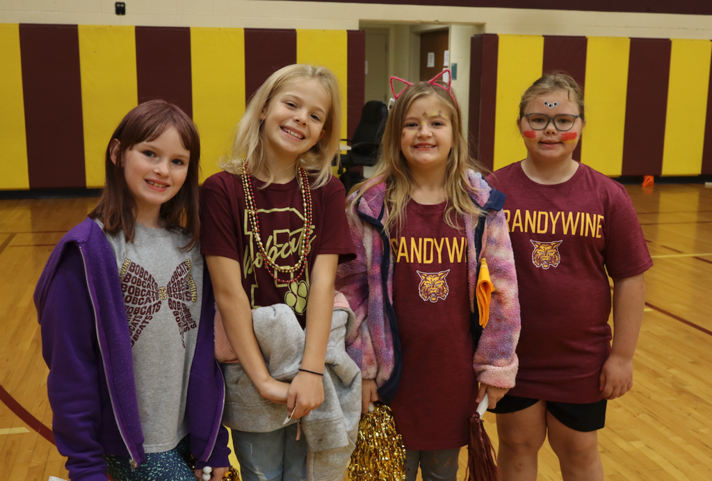 group of 4 girls in spirit wear