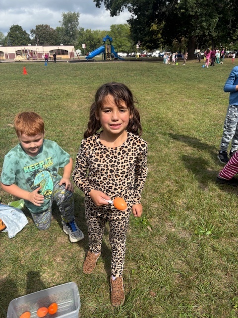 little girl holding eggs