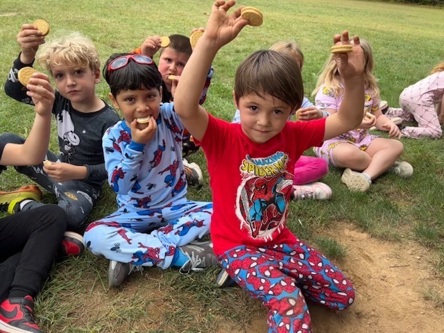 group of kids holding cookies