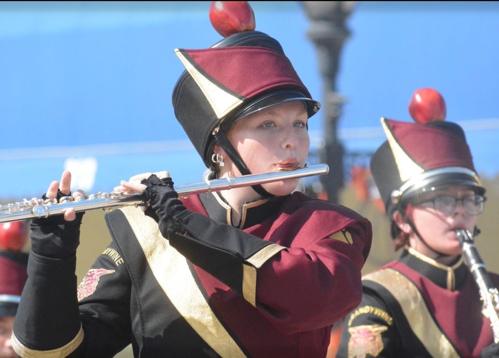 girl playing flute in marching band