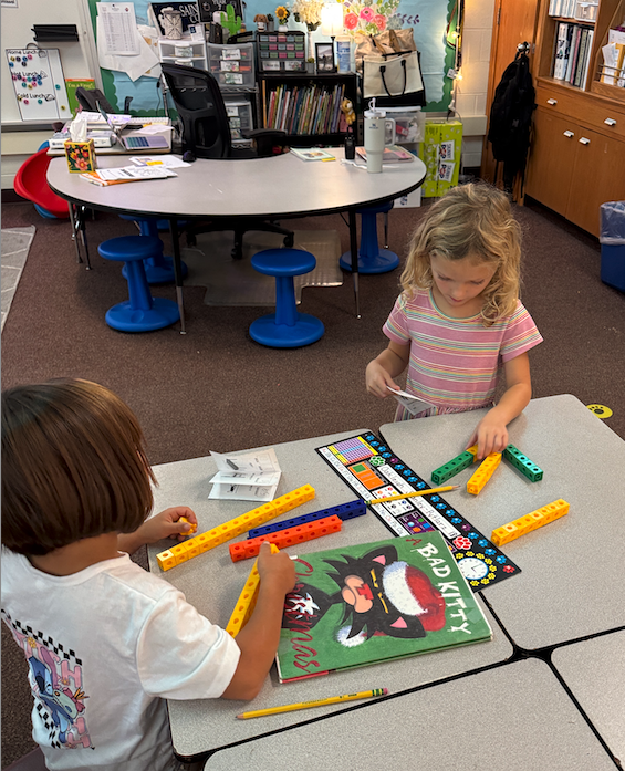 students playing with blocks at their desk