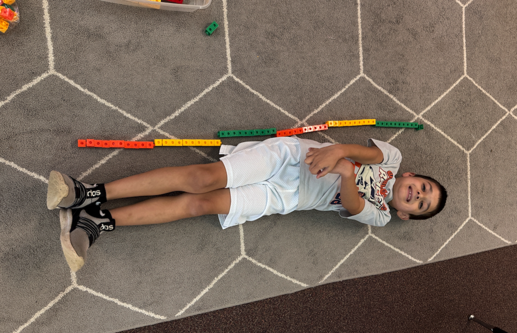 student laying on the ground 