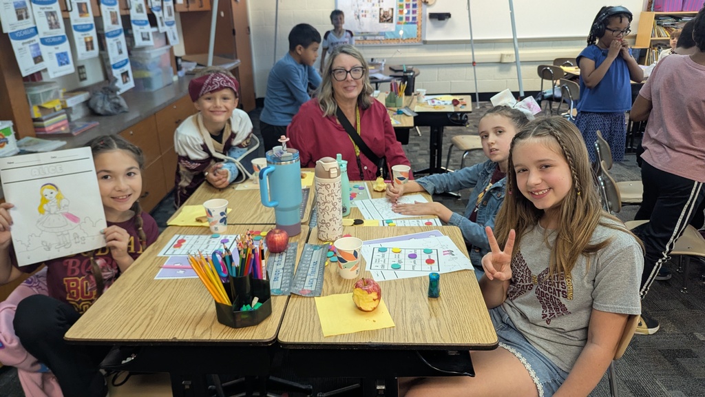 students sitting at a desk
