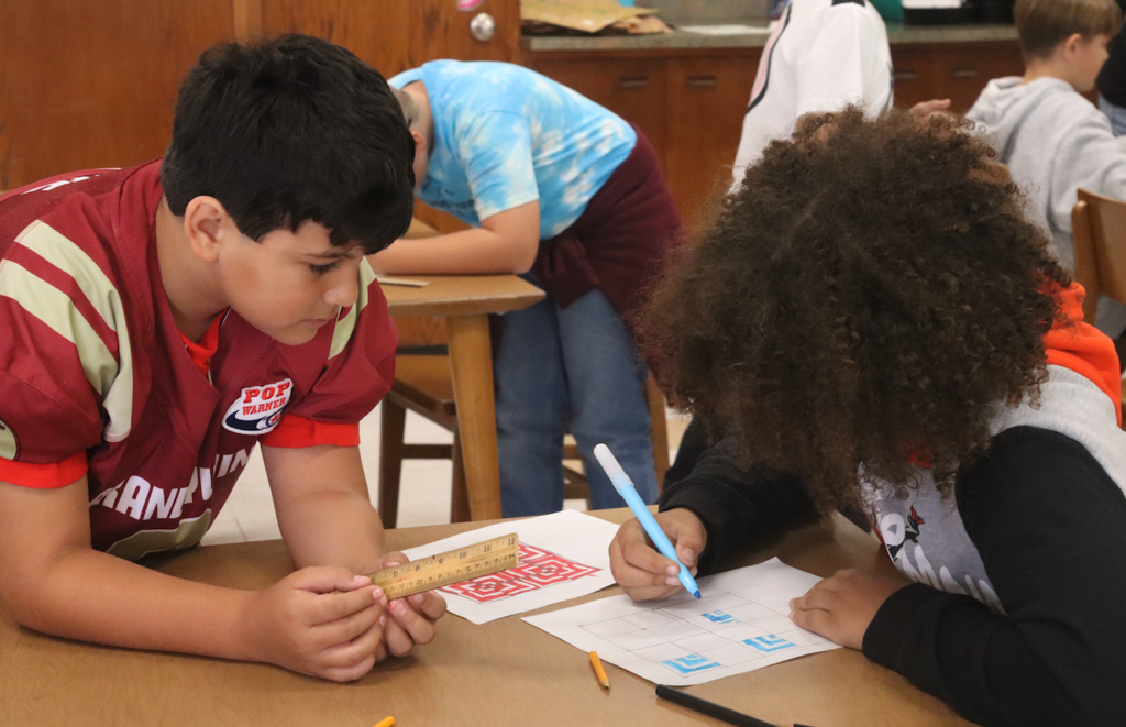 two boys working in art class
