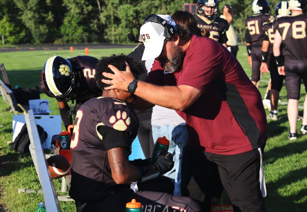 football coach with team