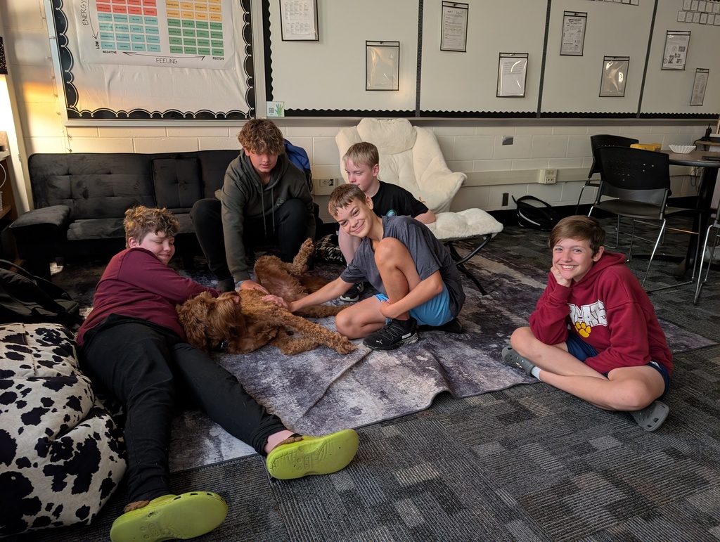 students petting therapy dog