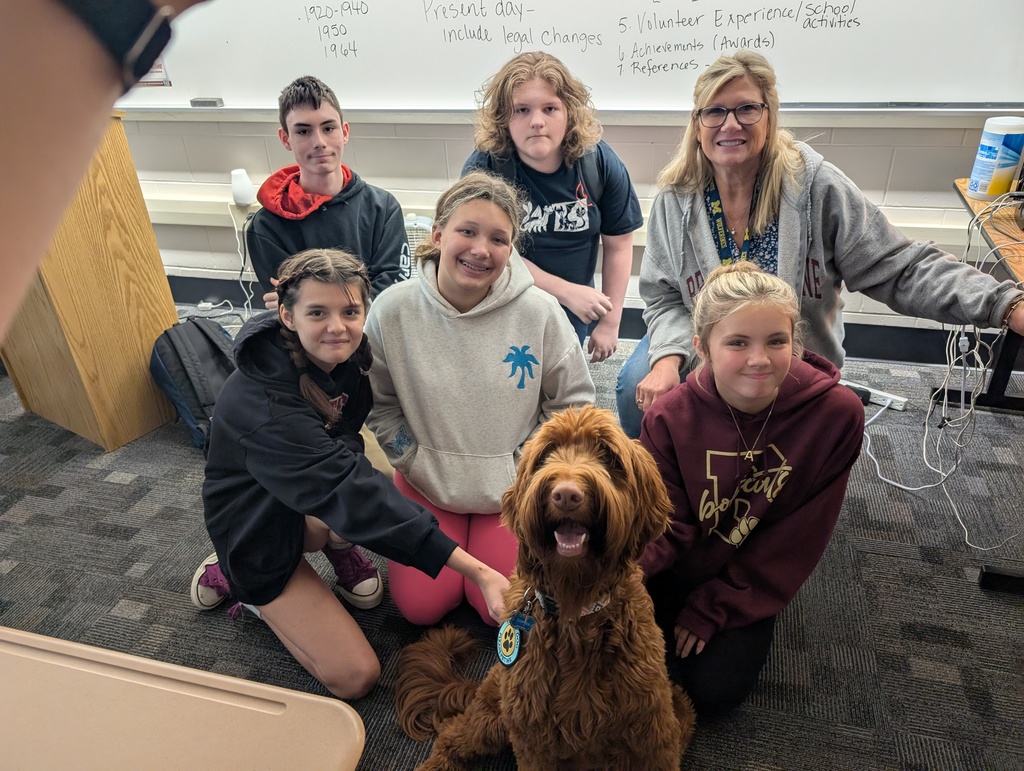 students with therapy dog