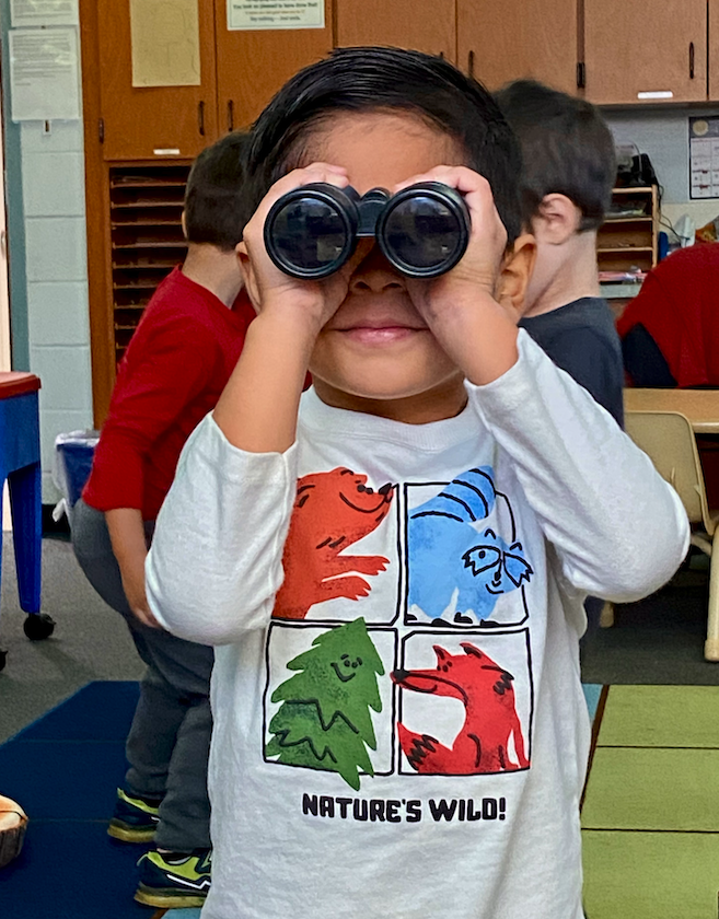 kid looking out binoculars