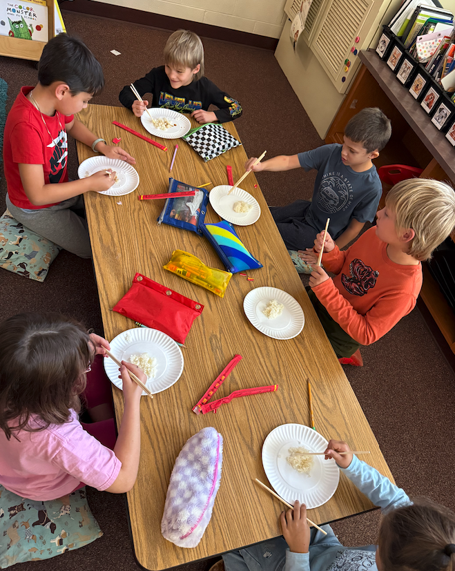 students using chopsticks