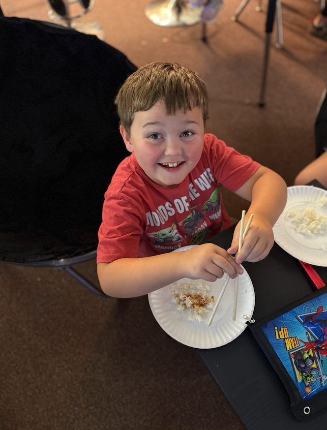 students using chopsticks