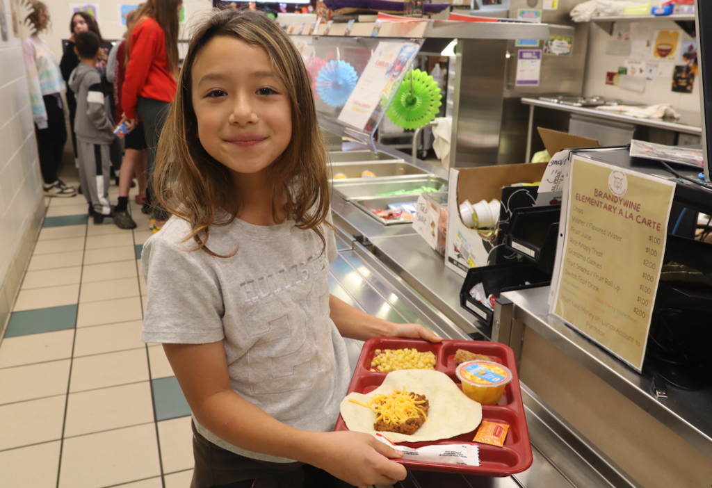 little girl in lunch line
