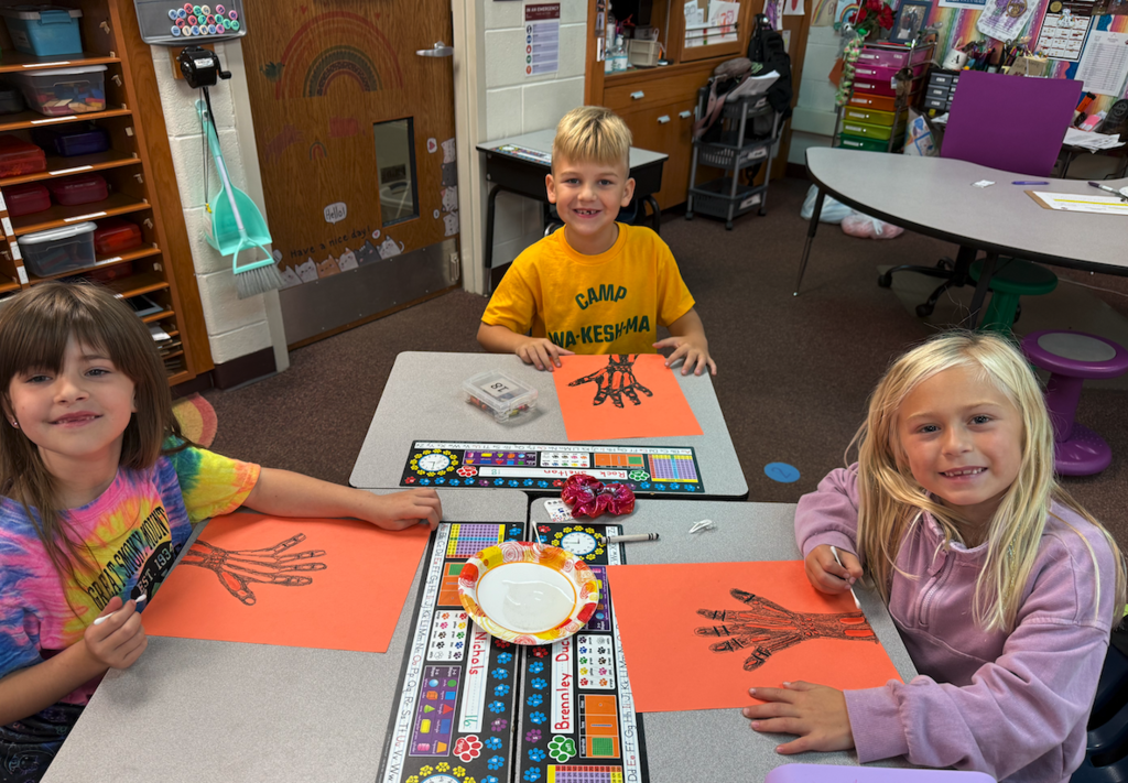students with drawings of hands