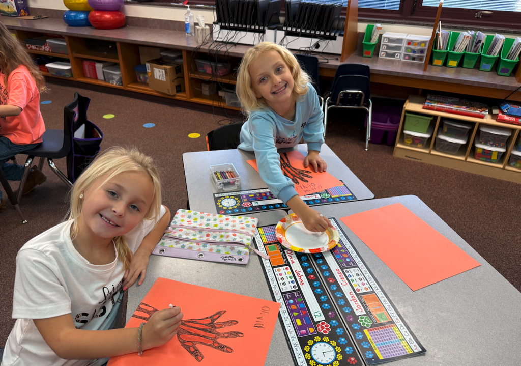 students with drawings of hands
