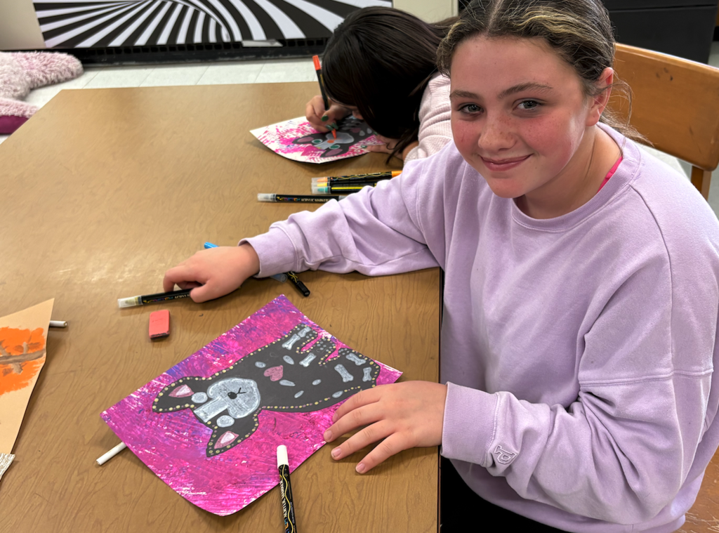 girl with drawing of dog