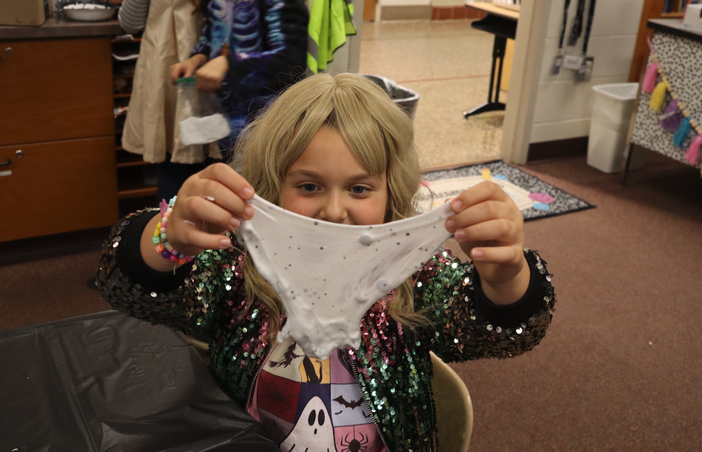 little girl holding slime