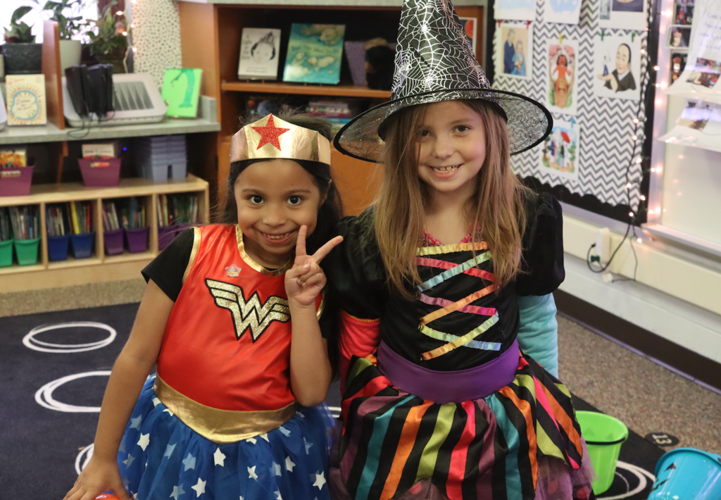 girls dressed as witch and wonderwoman