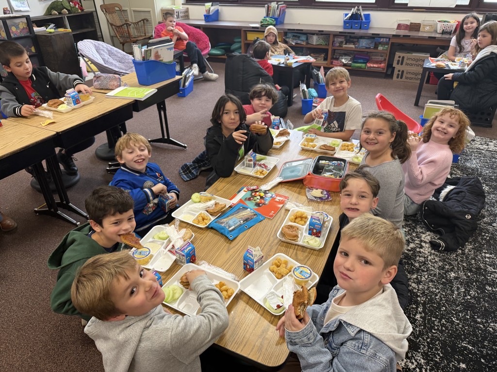 students eating lunch at their desks