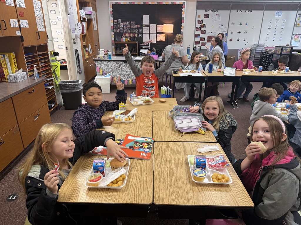 students eating lunch at their desks