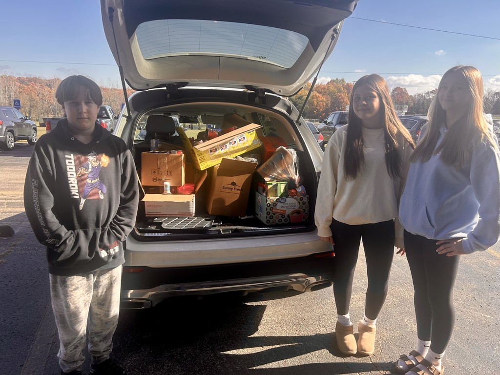 kids with cans in car