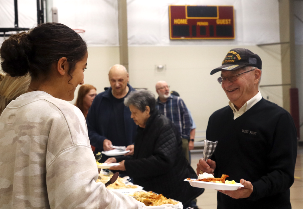 veterans being served breakfast