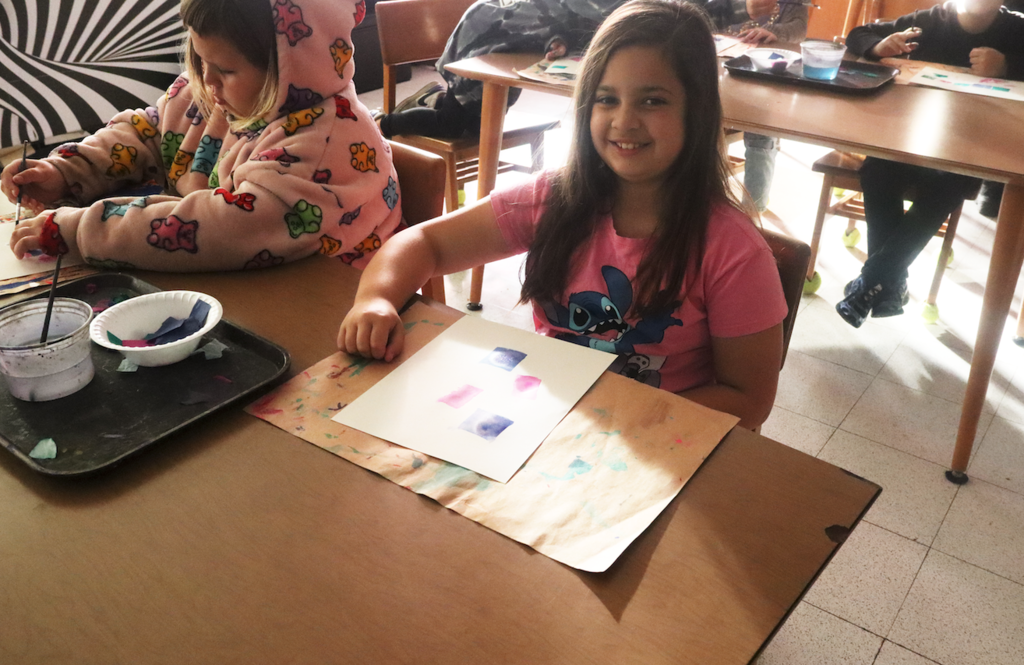 little girl with art project