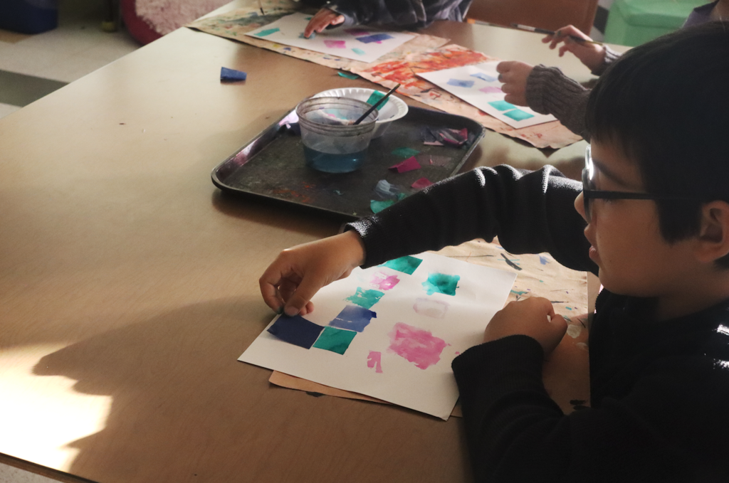 little boy working on art project