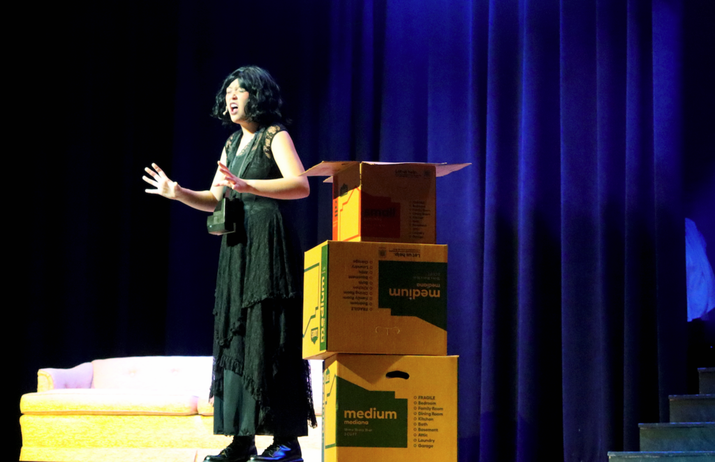 student singing on stage