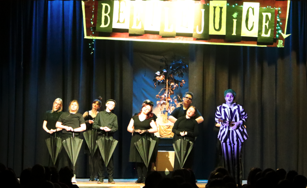 students standing on stage