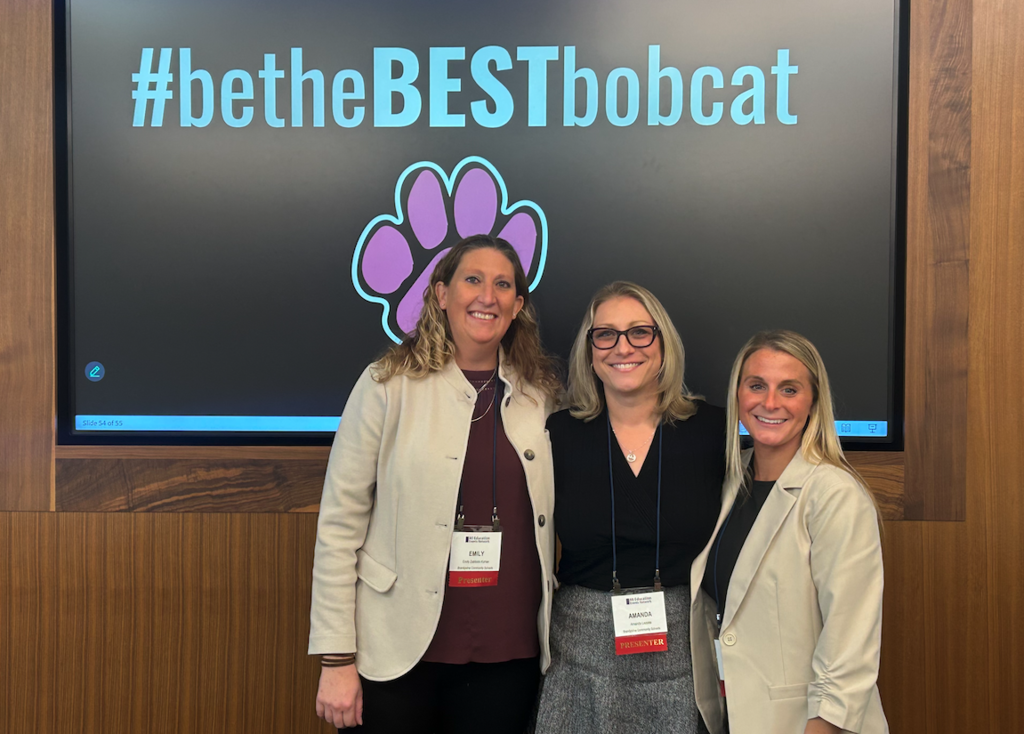 three presenters with betheBESTbobcat behind them