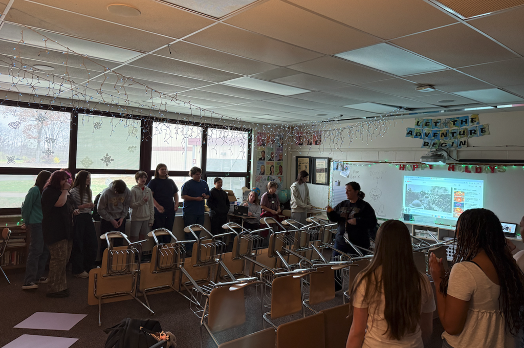 students in classroom behind desks