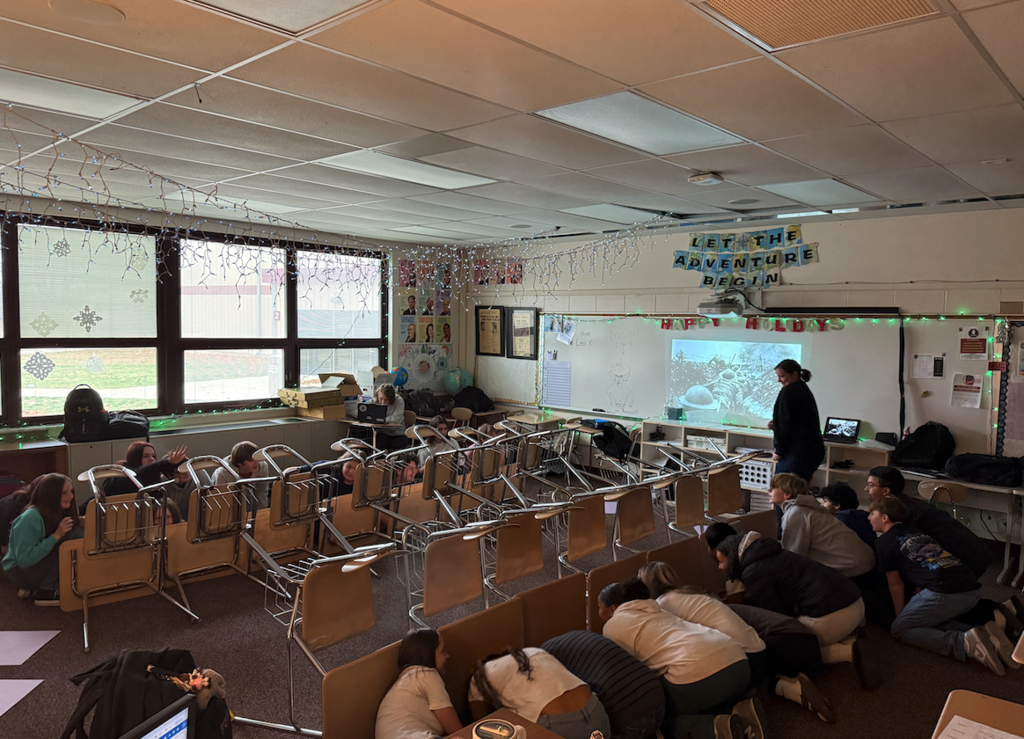 students in classroom behind desks
