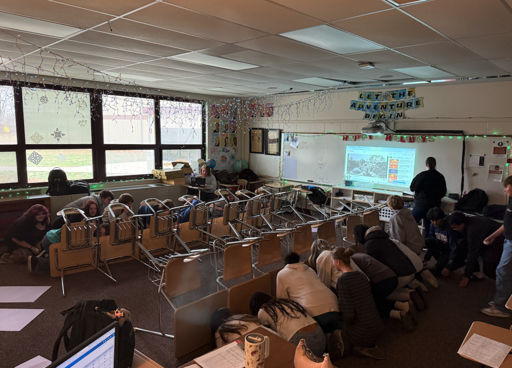 students in classroom behind desks