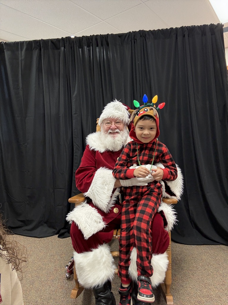 little boy sitting on Santa's lap