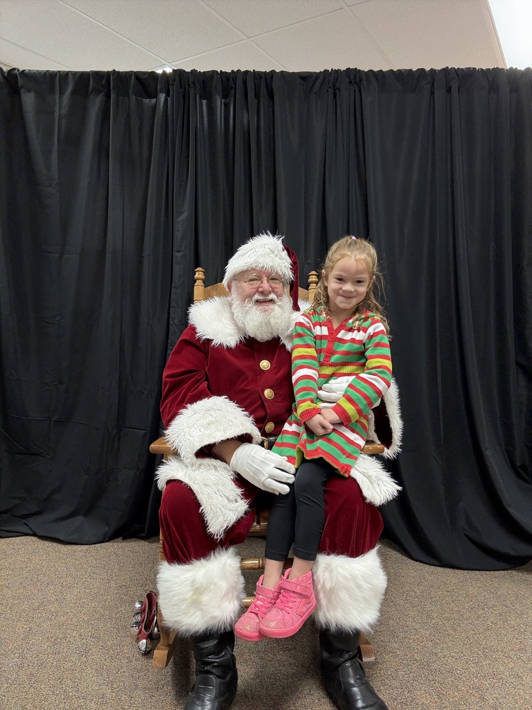 little girl sitting on Santa's lap
