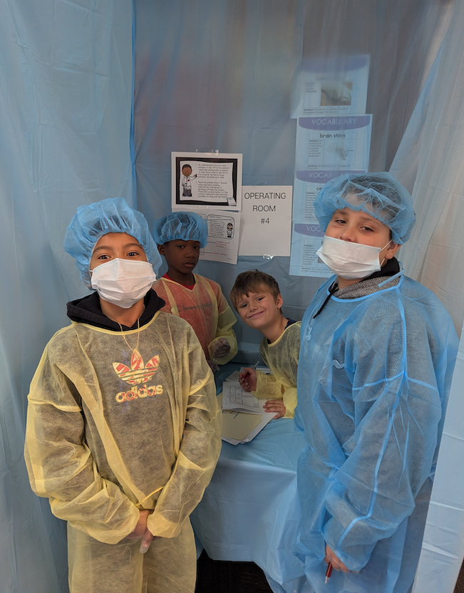 students dressed as doctors