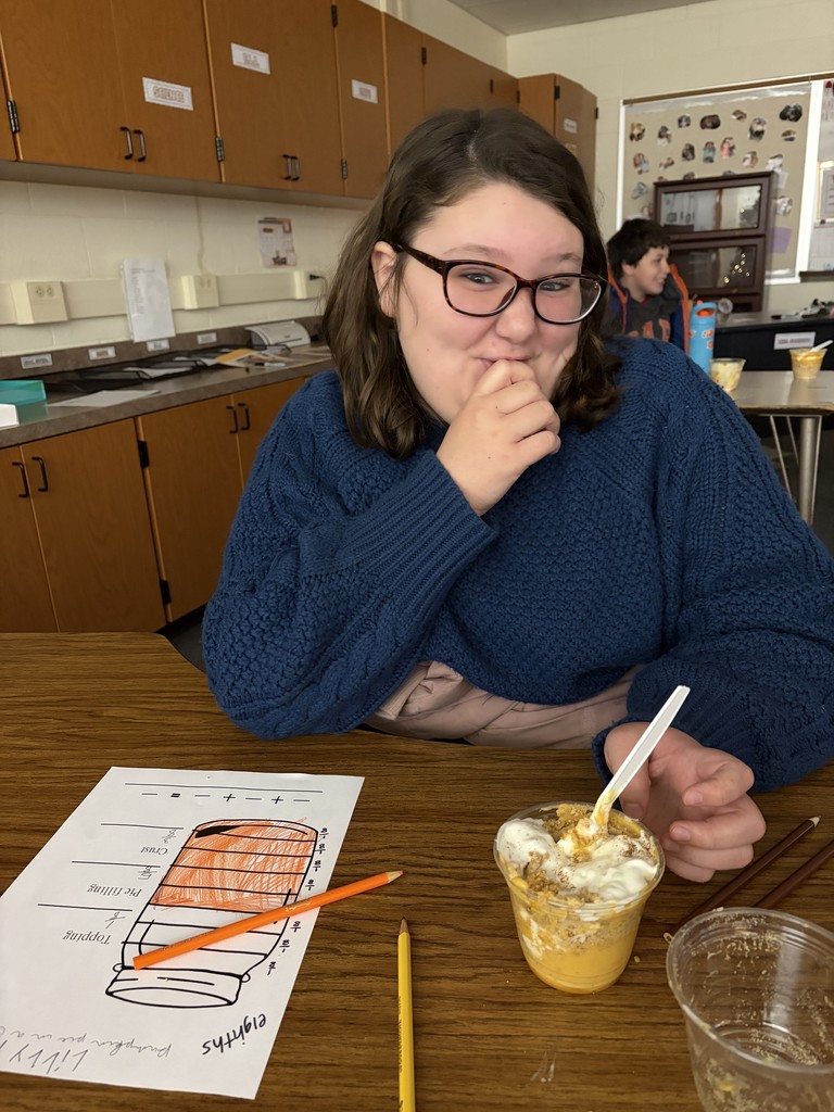 student eating pie