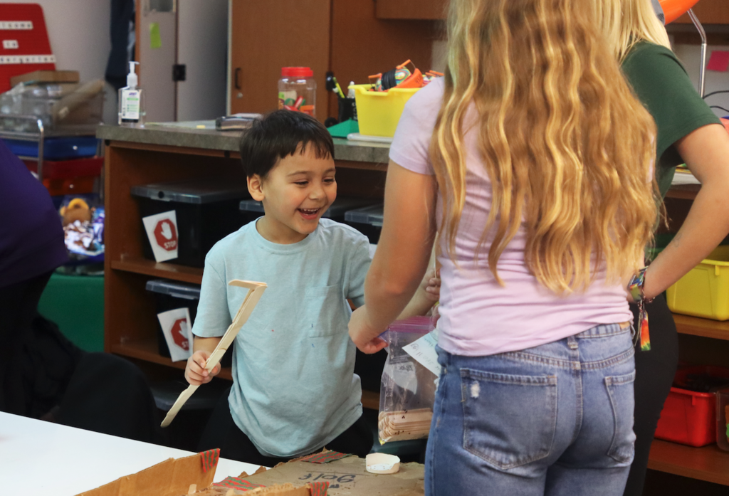little kid playing with toy