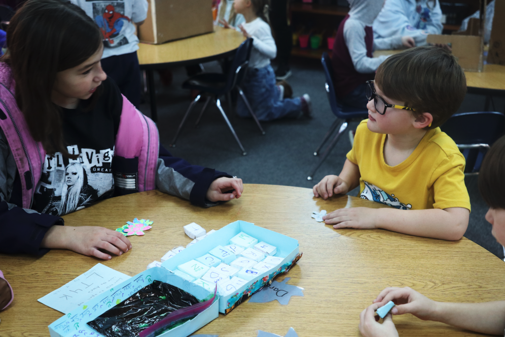 student playing with tic toe game