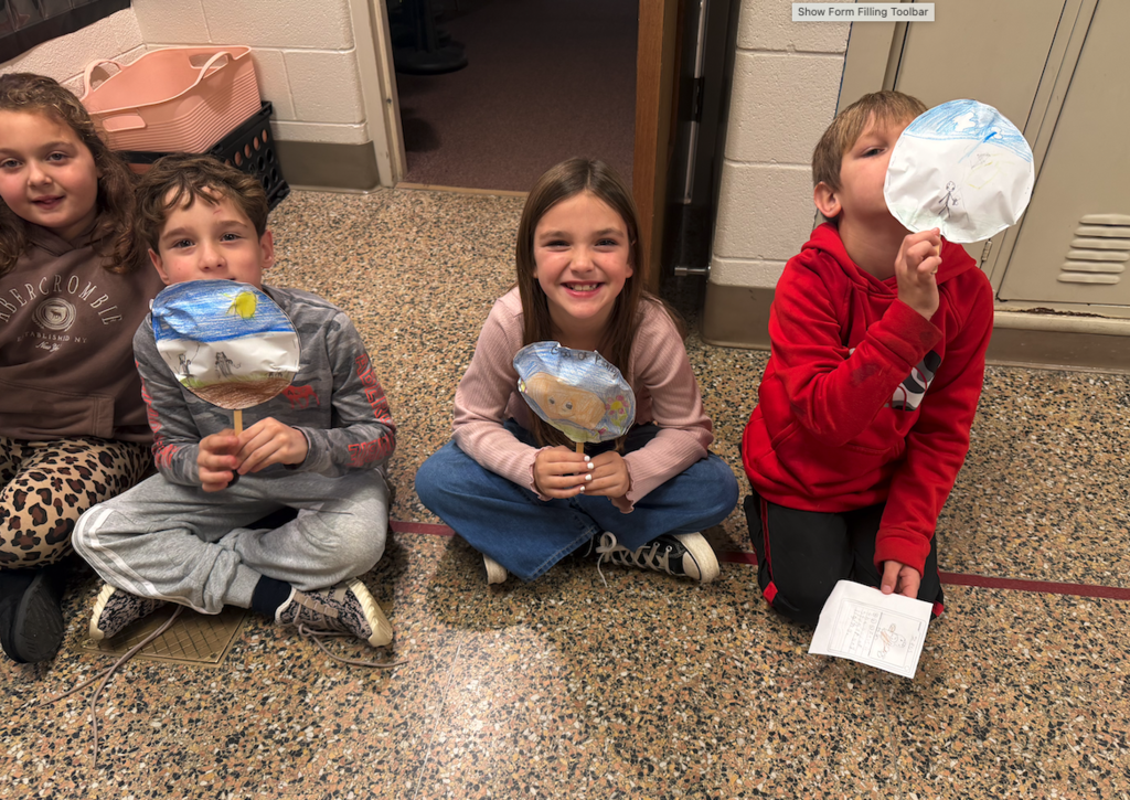 kids holding balloons