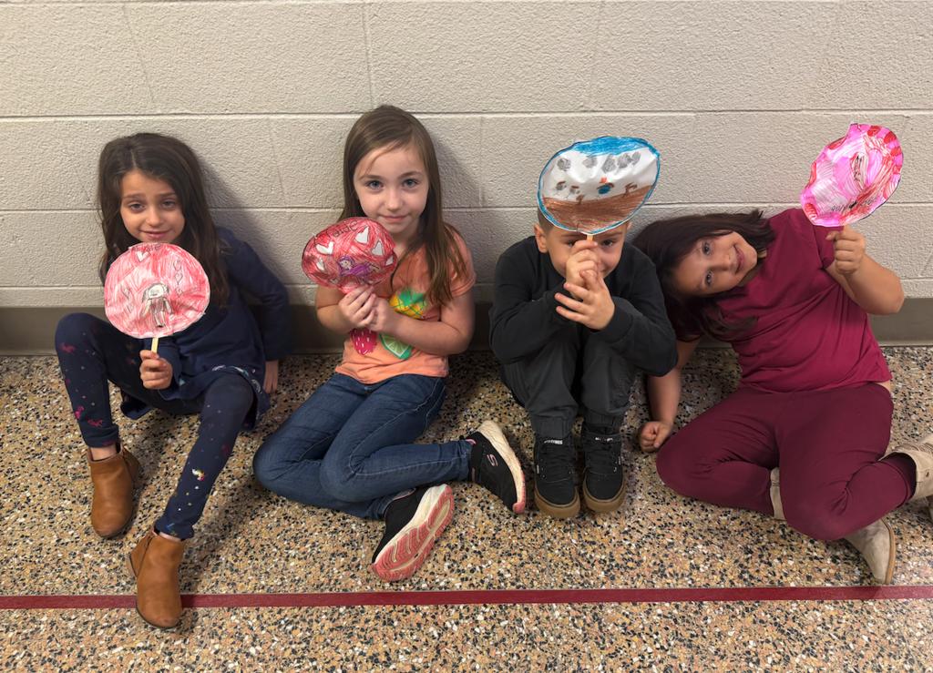 kids holding balloons