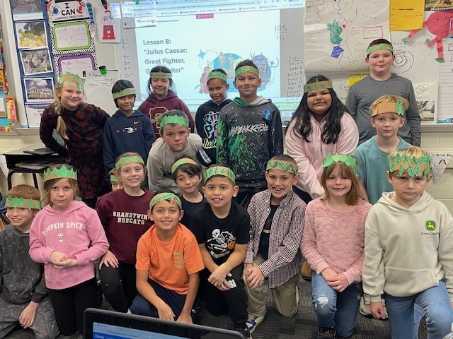 third grade students wearing crowns